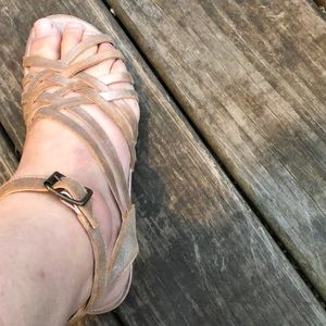 Rose gold sandals.  Flat.